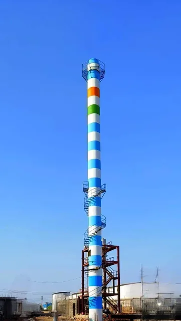 Tall industrial chimney with coloured bands and an external access ladder.